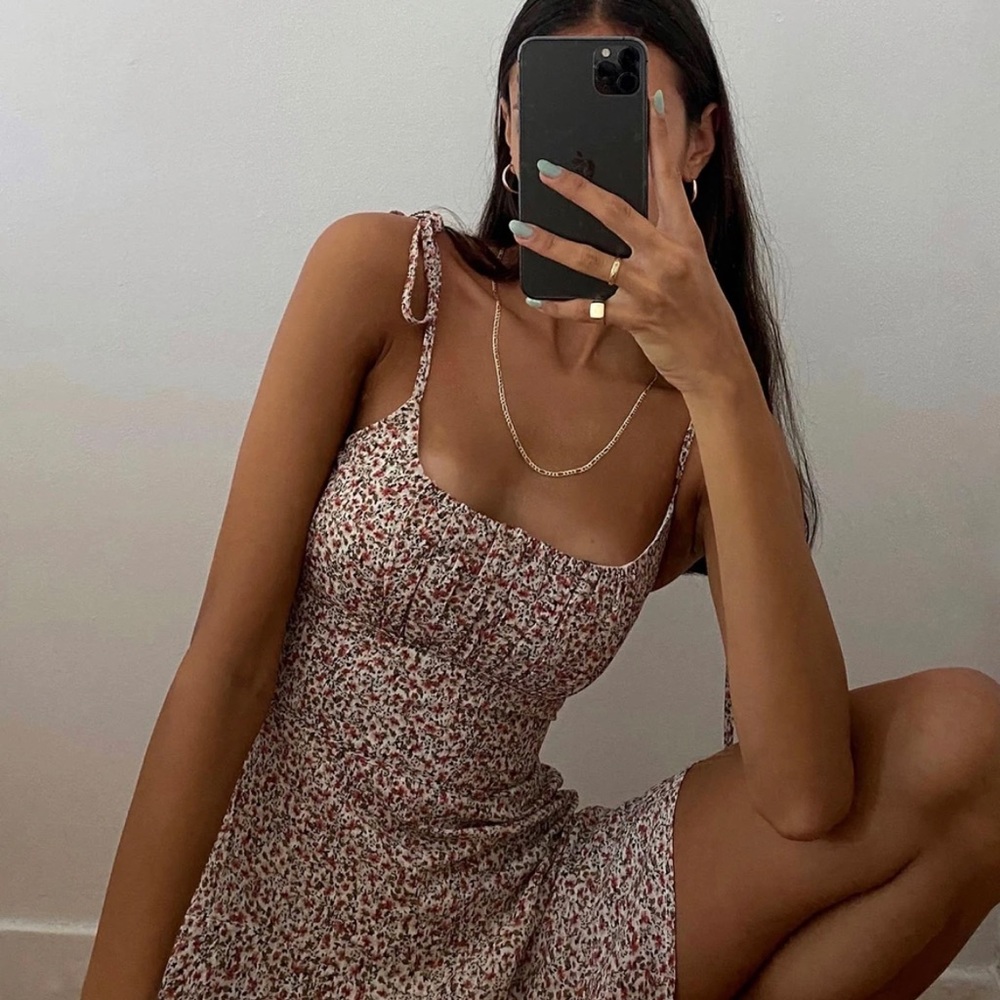 Red/pink floral romper. Tie shoulders. NEVER WORN.